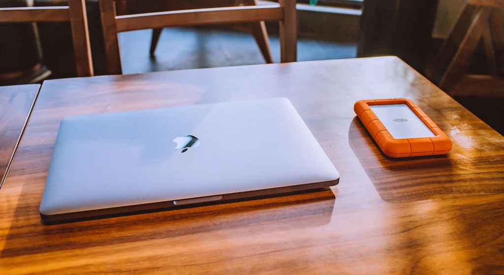 Laptop and external storage retained as a general illustration for testing local media files